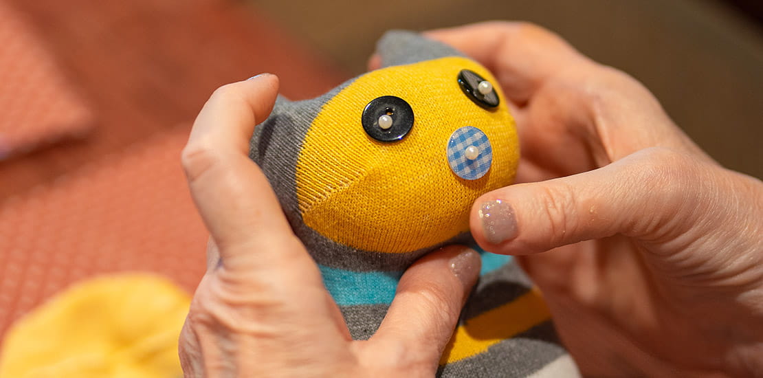 A sock teddy created during a workshop with the Supercrafters
